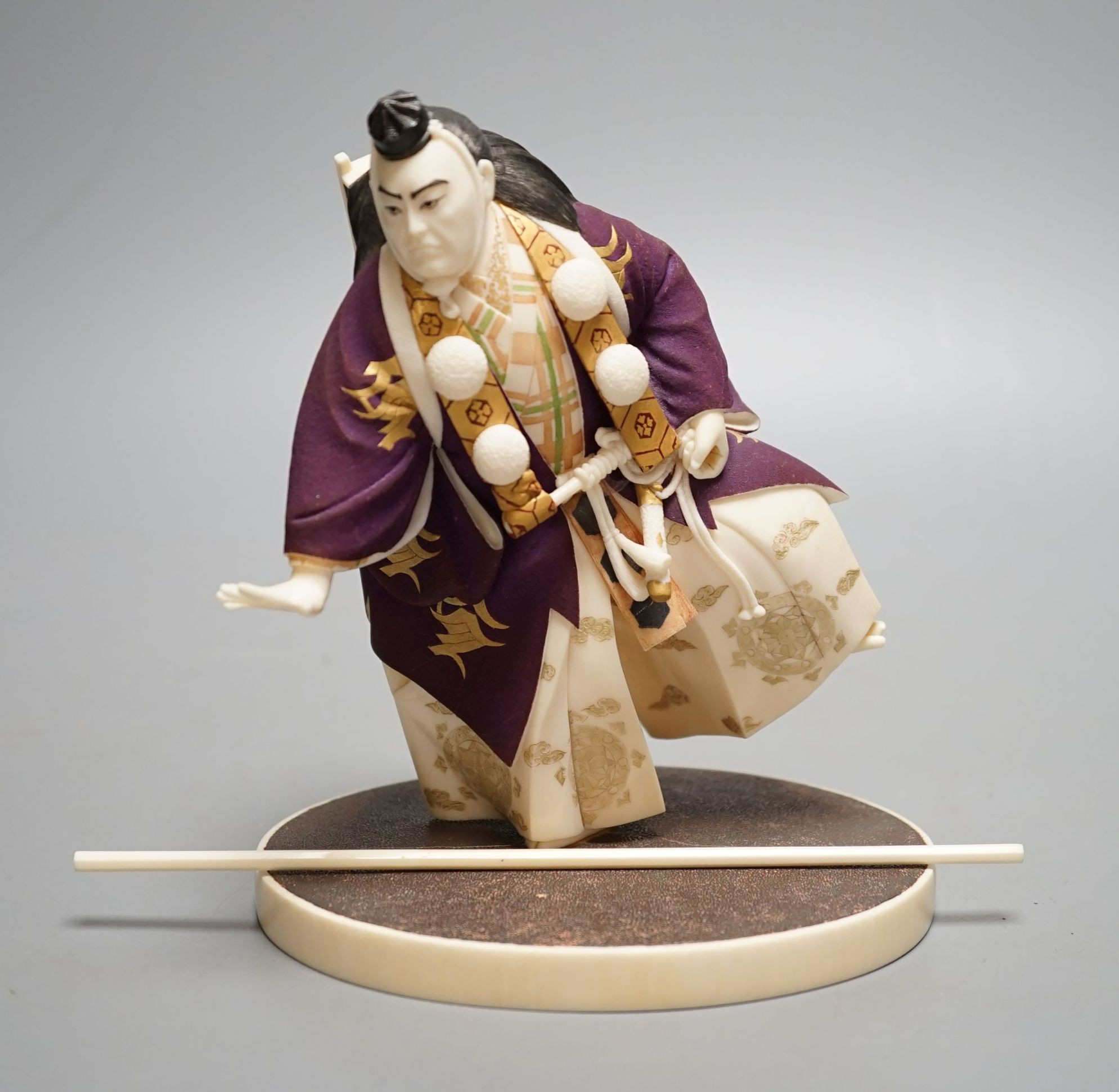 A Japanese ivory figure of a performing Yamabushi warrior monk, Taisho/early Showa period, signed to a lacquer tablet - 17cm tall